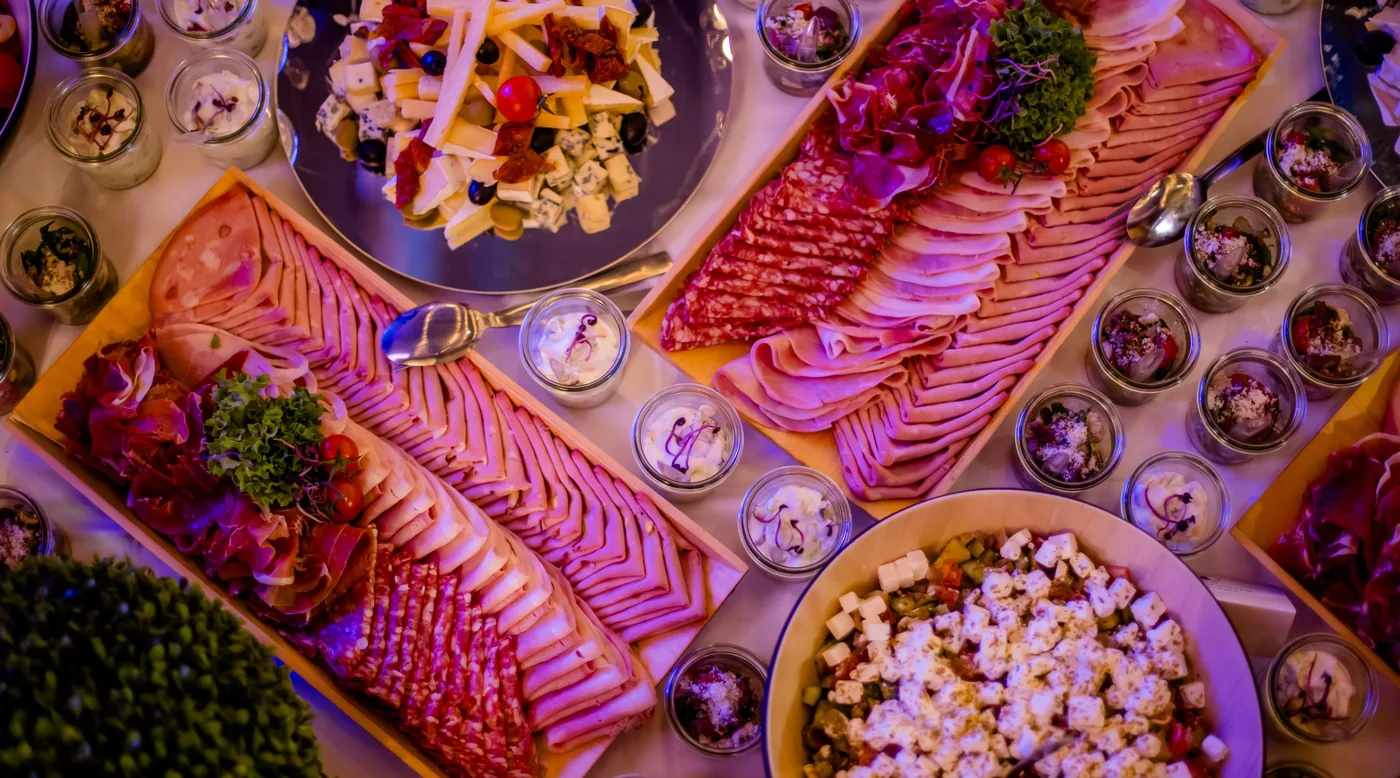 Cold platters, cheeses and salads on the buffet table